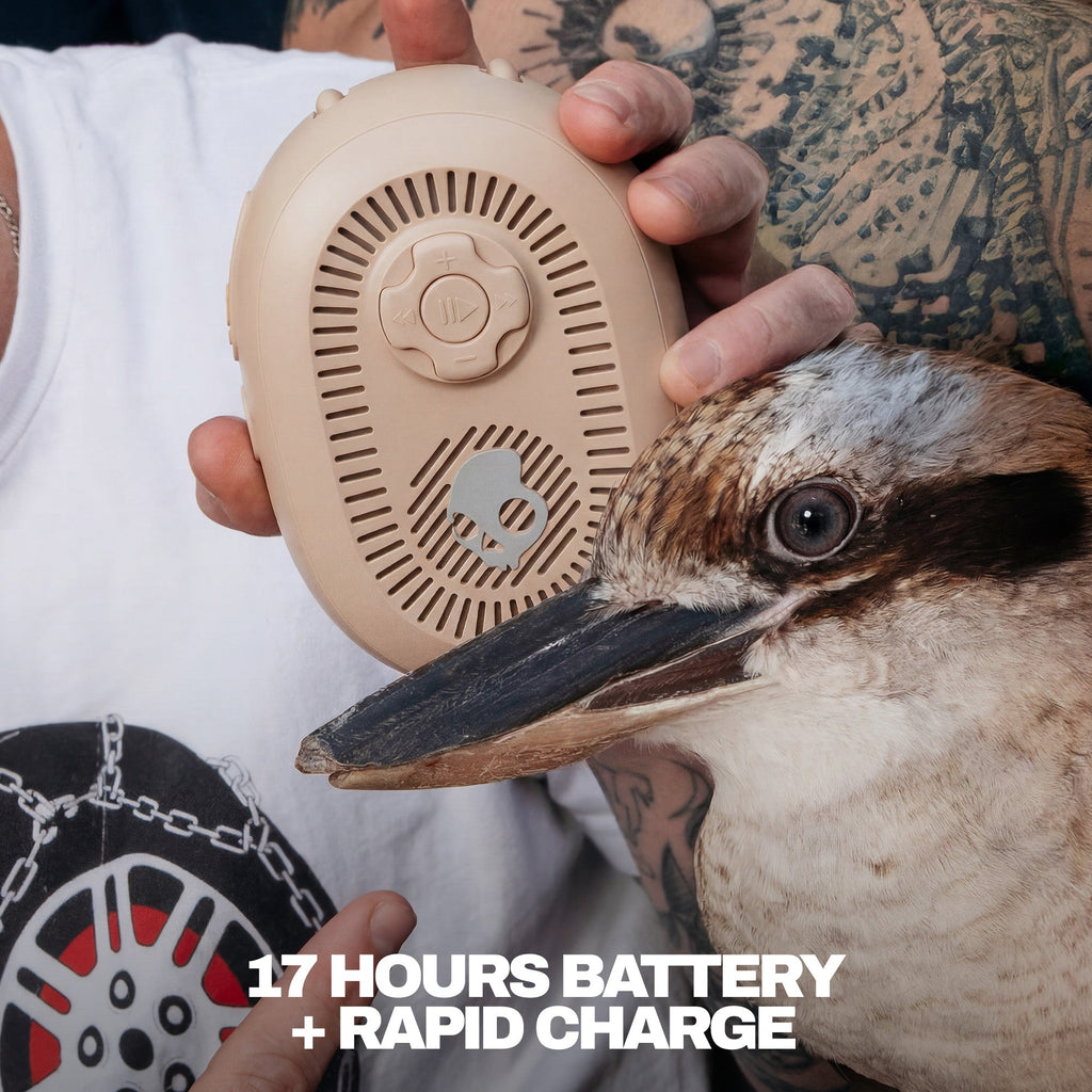 Person holding a beige portable speaker next to a bird, with text about battery life and charging. | Primer