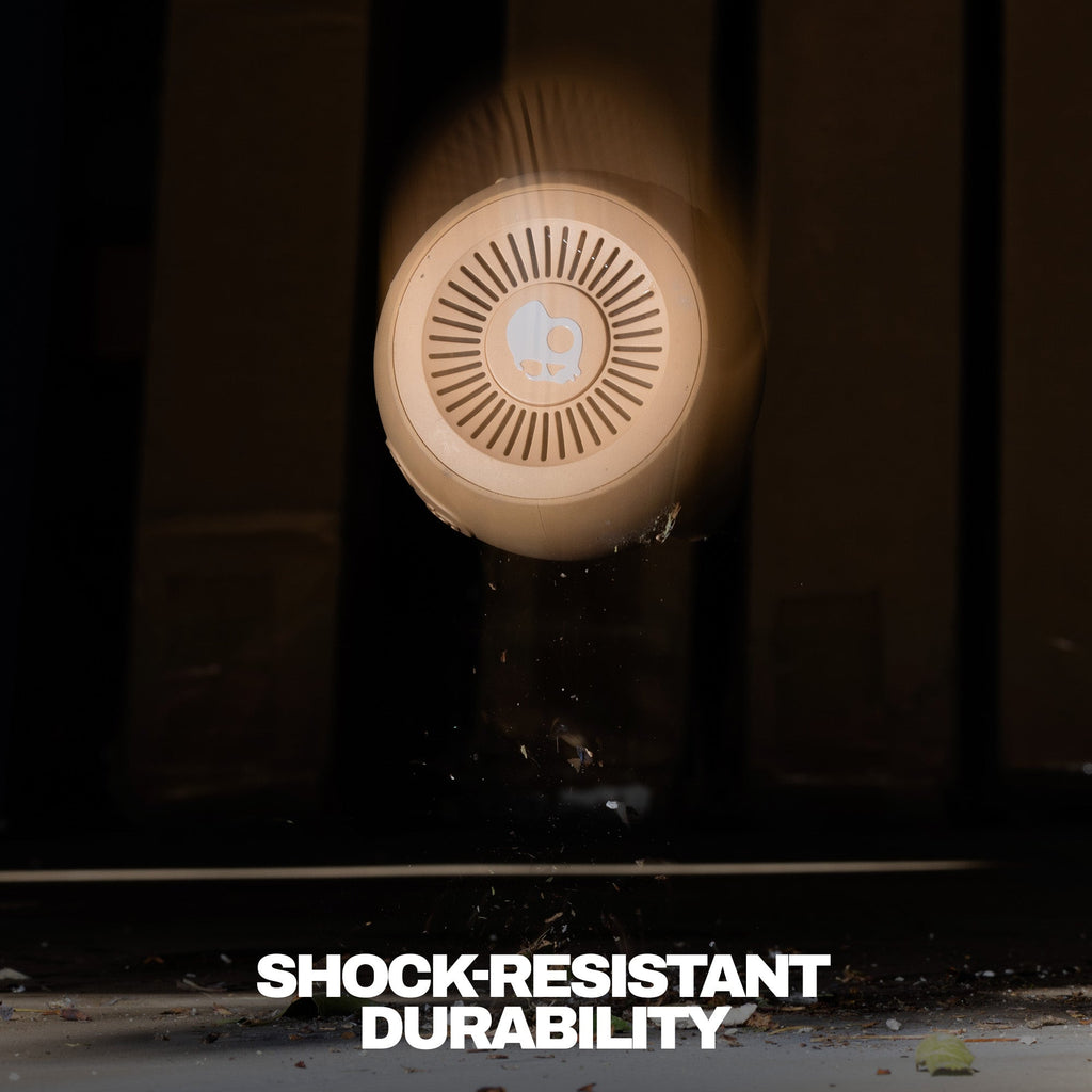 Round shockproof device with 'Shock-Resistant Durability' text on a dark background | Primer