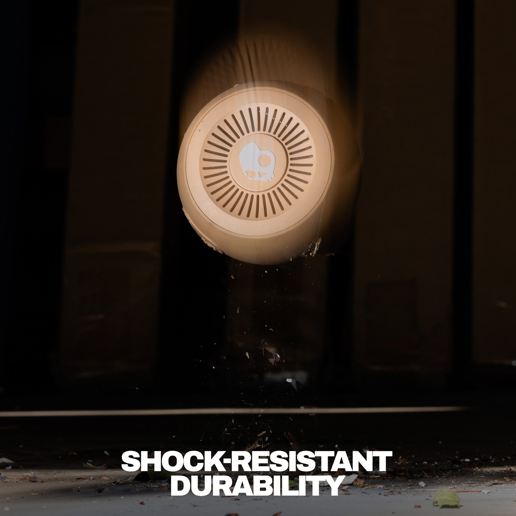 Round shockproof device with 'Shock-Resistant Durability' text on a dark background | Primer