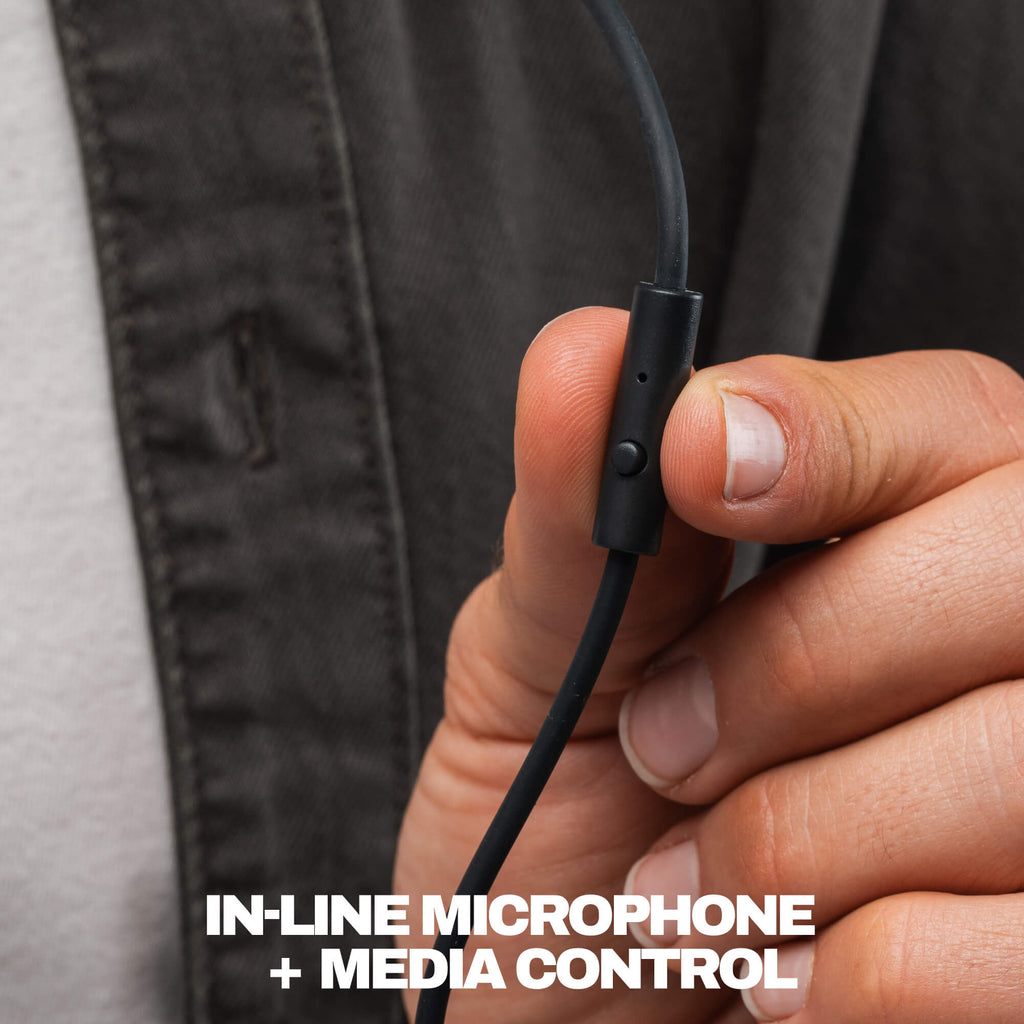 Close-up of a person's hand holding a black wired in-line microphone and media control module, with white text at the bottom reading 'IN-LINE MICROPHONE + MEDIA CONTROL'. | True Black