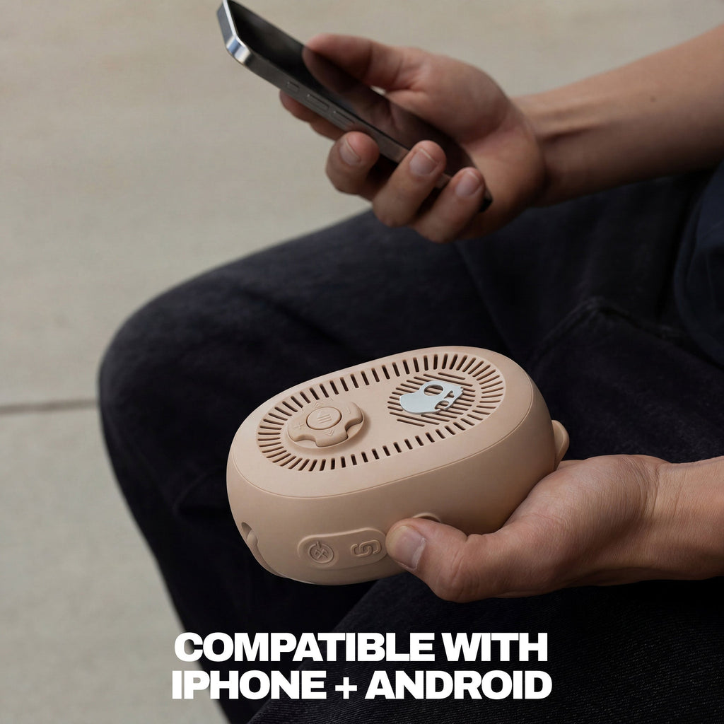 Person holding a beige portable device and a smartphone, with text indicating compatibility with iPhone and Android. | Primer