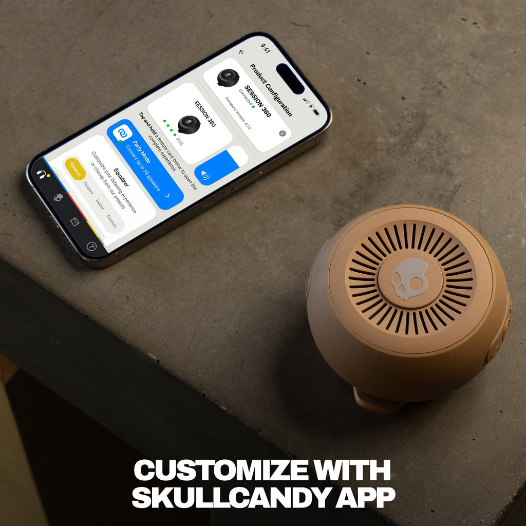 Smartphone displaying an app interface next to a brown Bluetooth speaker on a concrete surface. | Primer