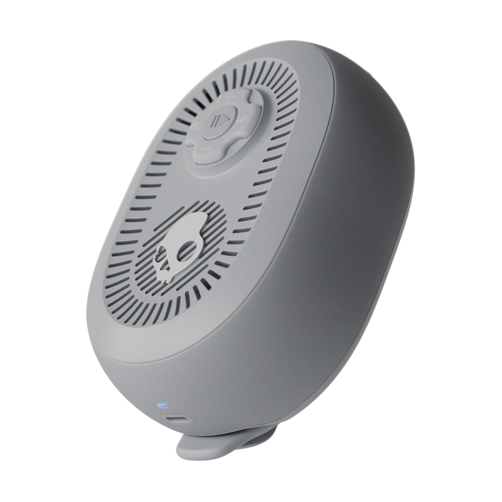 Gray electronic device with a circular design on a white background | Cement