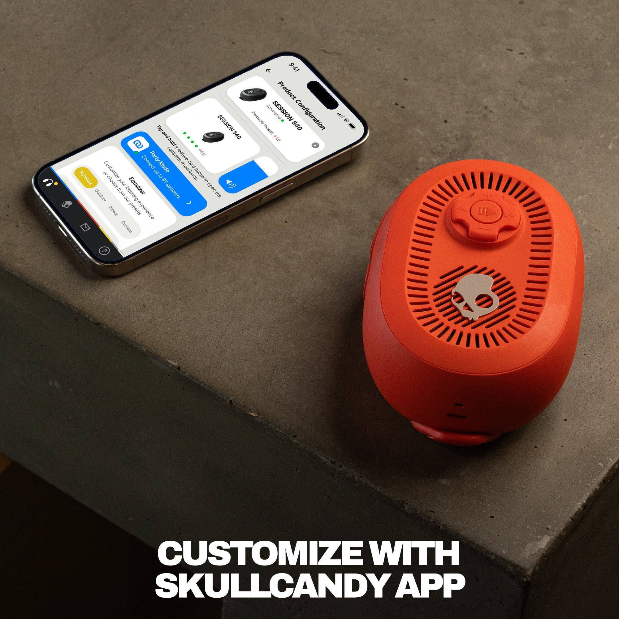 red Bluetooth speaker next to a smartphone on a concrete surface with text 'Customize with Skullcandy App'. | Plasma