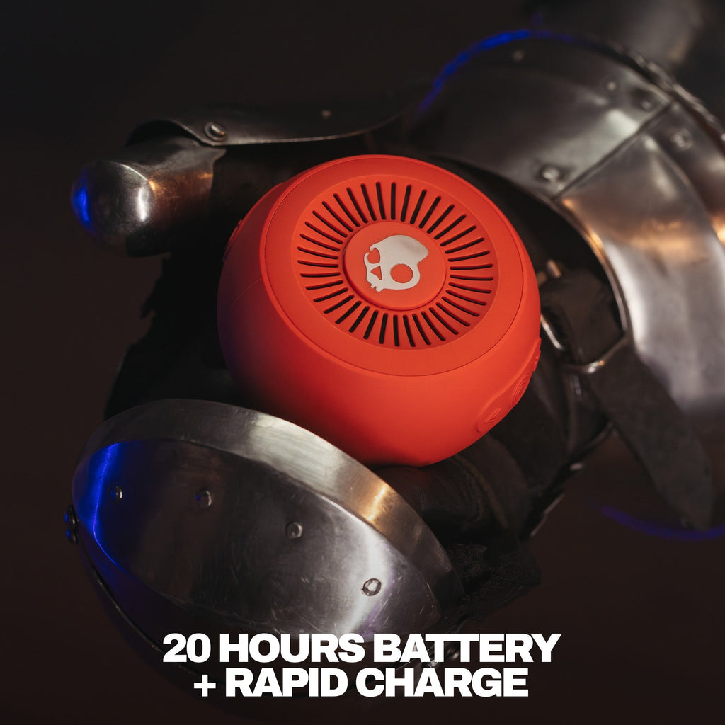Red portable speaker with a brand logo on a dark background, featuring text about battery life and charging speed. | Plasma