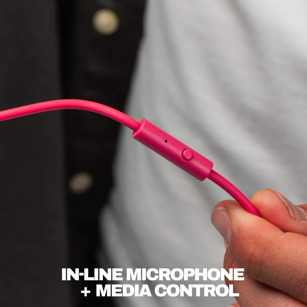 A close-up of a bright pink wired earbud inline microphone and media control module being held by a hand, with the text 'IN-LINE MICROPHONE + MEDIA CONTROL' at the bottom. | Crazy Pink