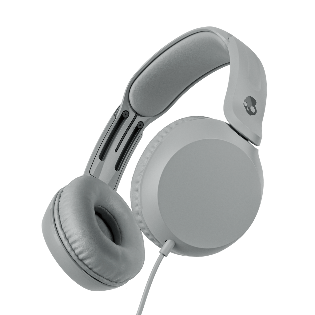 Grey over-ear wired headphones shown at an angle against a solid black background. | Cement