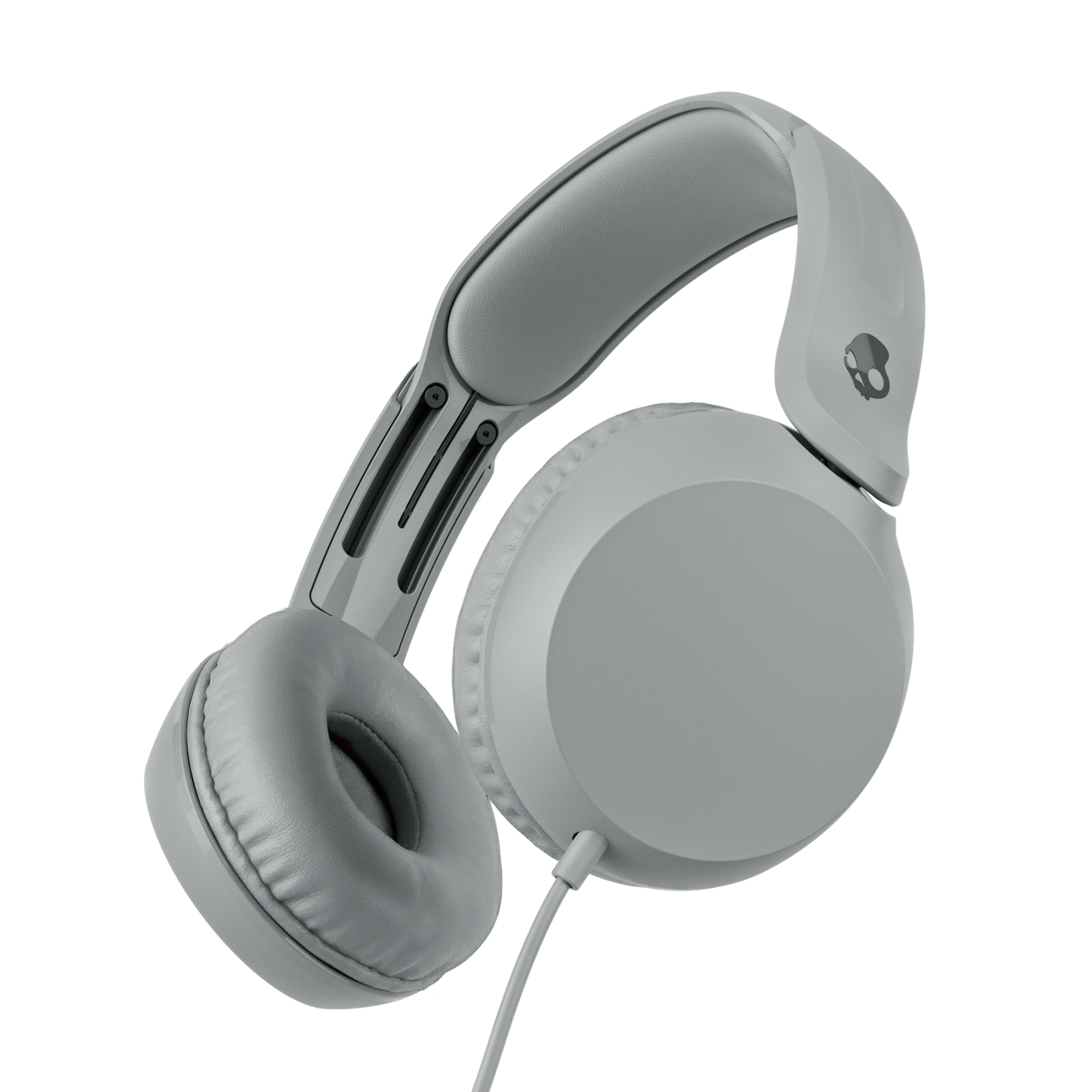 Grey over-ear wired headphones shown at an angle against a solid black background. | Cement